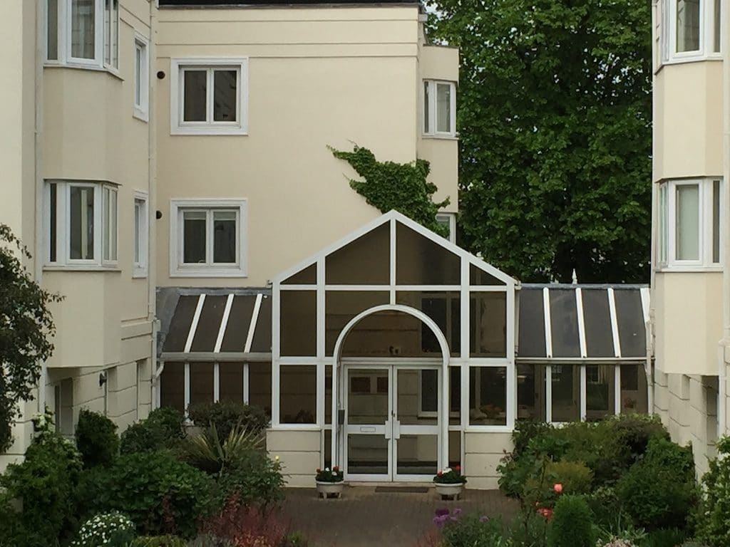 Commercial conservatory roof panels in an old conservatory at a block of flats